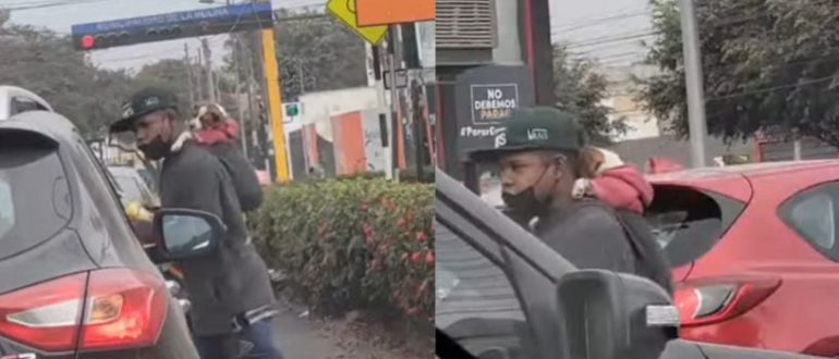 Ein junger Mann trägt den Hund auf dem Rücken, während er die Windschutzscheibe reinigt (Video)